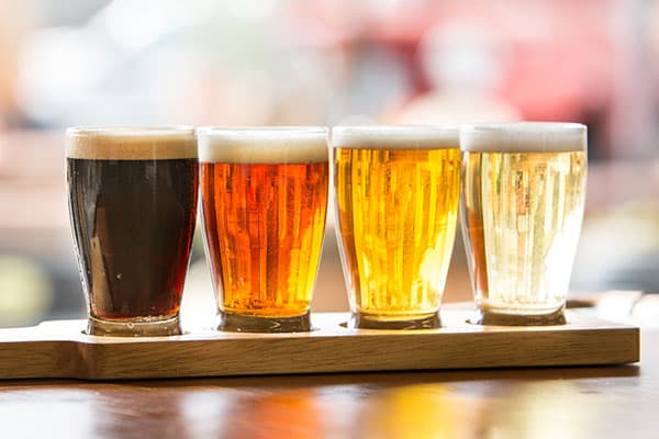 Four glasses of beer on a table